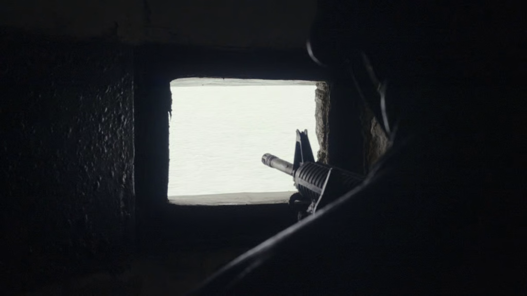 Overt-listening_nyff64_01jpeg | the Cinema Group Rifle Barrel Protrudes Through a Square Opening in a Dark Bunker Wall, Aiming Toward the Bright Exterior.